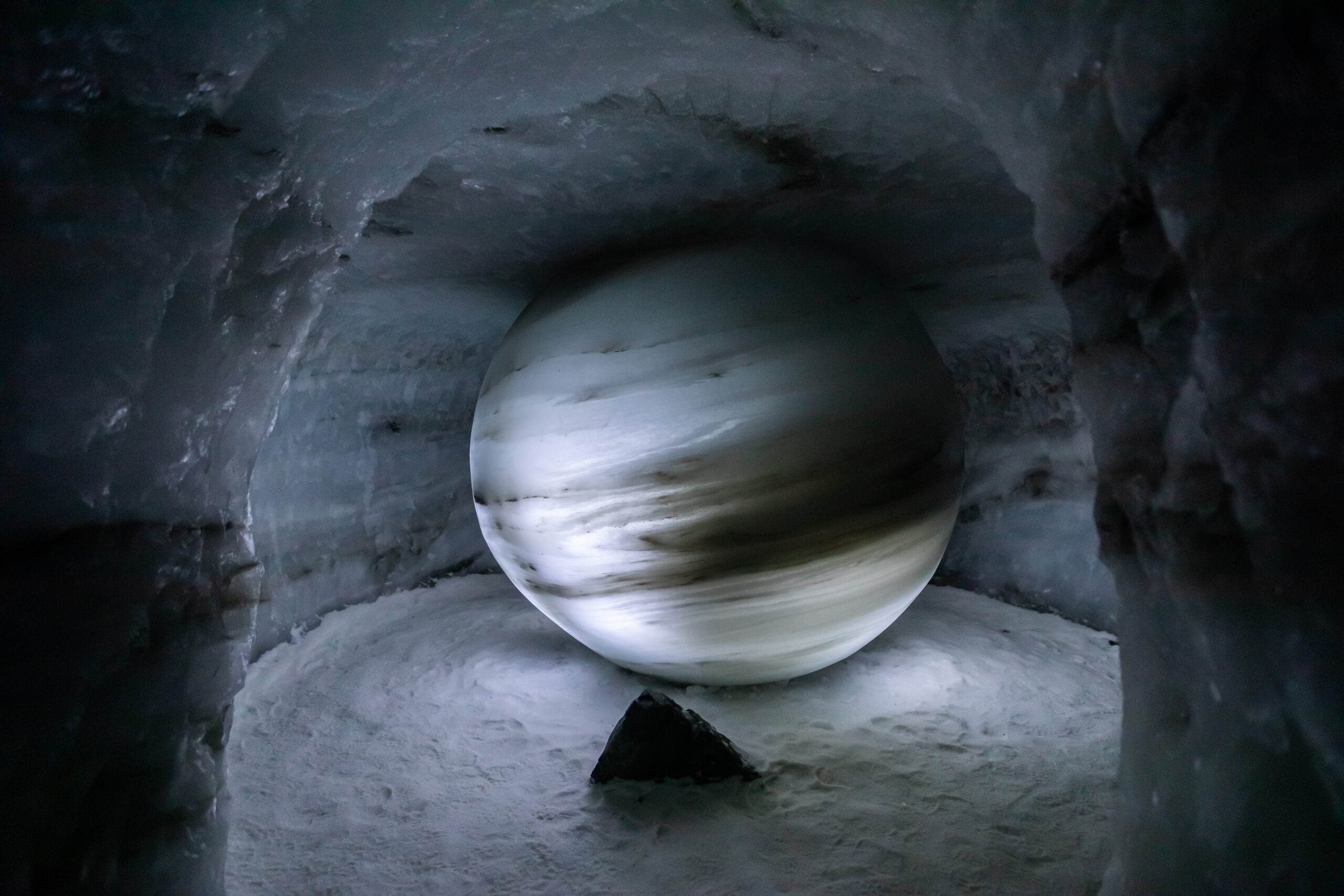 A picture of a globe made of ice. 